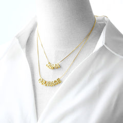 Letra de cobre bañada en oro de 18 quilates