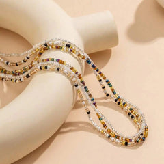 Conjunto de cadena para la cintura con cuentas de arroz de tres colores variados, versátil y a la moda, para mujer.