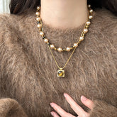 Collar de piedra de ojo de tigre natural con doble perla y cadena tipo suéter