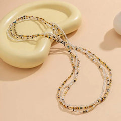 Conjunto de cadena para la cintura con cuentas de arroz de tres colores variados, versátil y a la moda, para mujer.