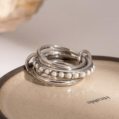 Anillo de acero inoxidable con dos perlas multicapa