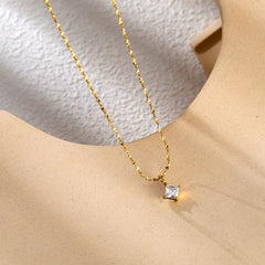 Collar con colgante de acero de titanio y forma de corazón con gotas de agua, al por mayor.