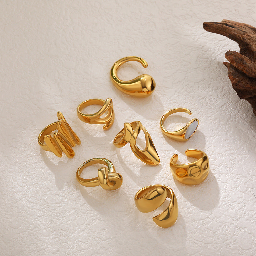 Anillos abiertos de acero y titanio de color sólido con gotas de agua geométricas de estilo simple.