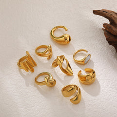 Anillos abiertos de acero y titanio de color sólido con gotas de agua geométricas de estilo simple.