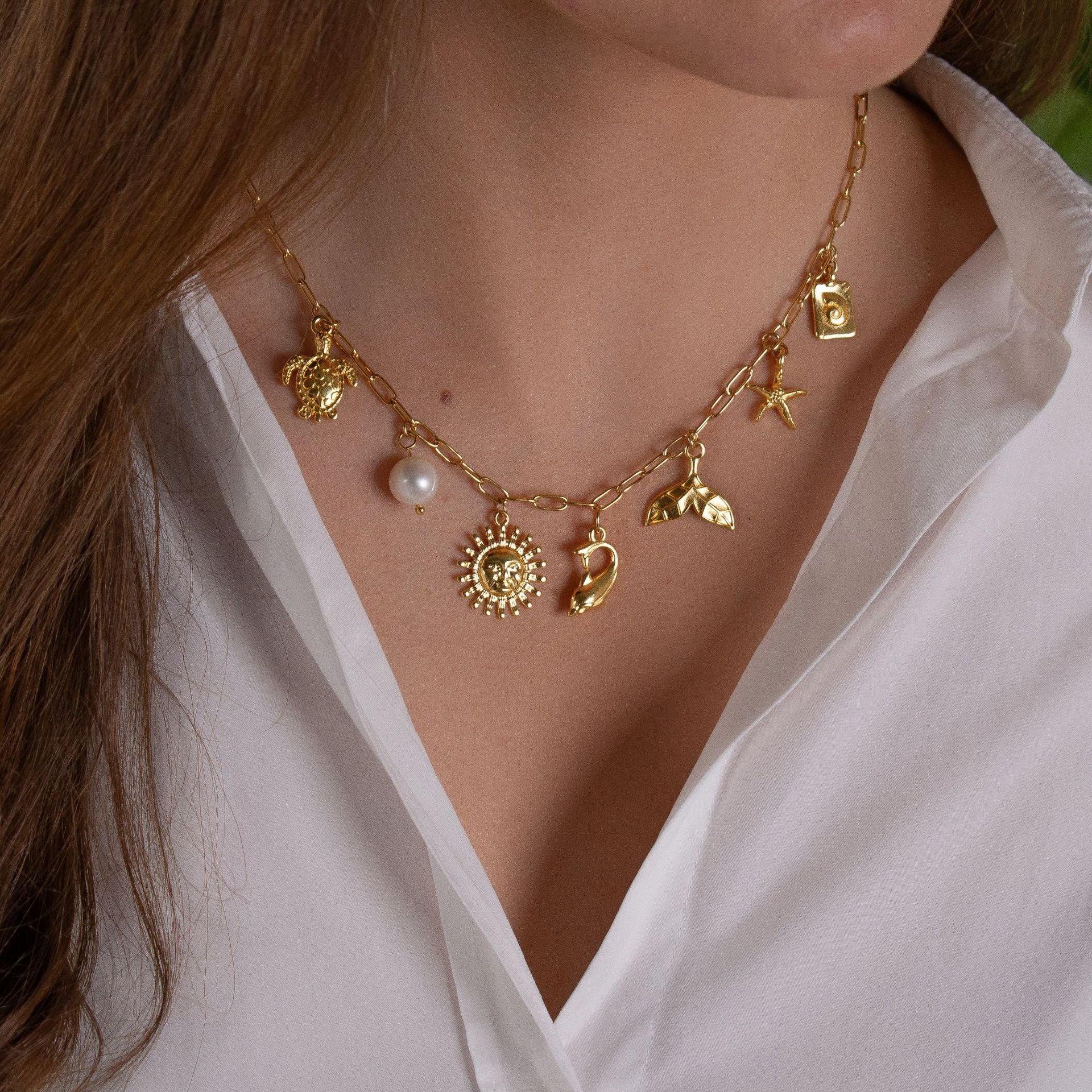 Collar con colgante de acero inoxidable 201 y 304 chapado en oro de 18 quilates con diseño de estrella de mar, delfín y concha de estilo marino.