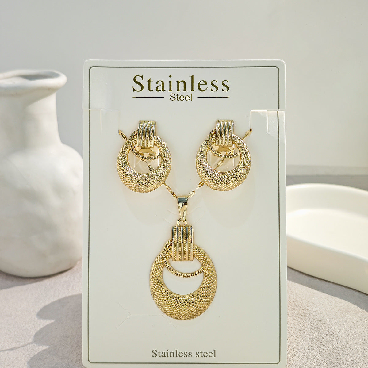 Conjunto de joyería elegante con diseño geométrico clásico de acero inoxidable 304 chapado en oro al por mayor