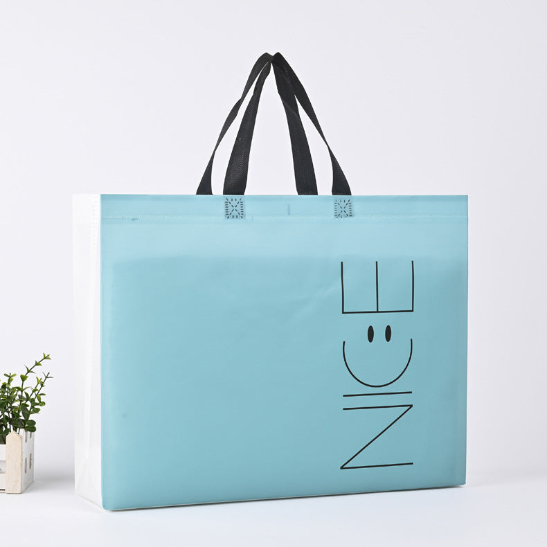 Bolsa de ropa no tejida prensada en caliente, disponible en stock, bolsa con expresión facial sonriente, bolsa de ropa para niños con impresión a color, bolsa de publicidad, impresión LO (por 50 piezas)