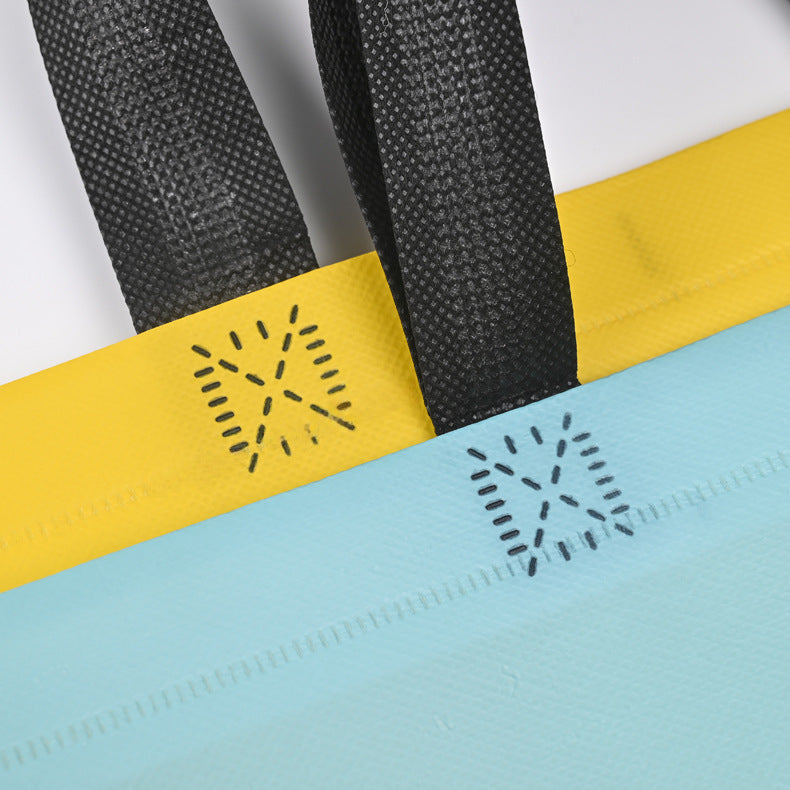 Bolsa de ropa no tejida prensada en caliente, disponible en stock, bolsa con expresión facial sonriente, bolsa de ropa para niños con impresión a color, bolsa de publicidad, impresión LO (por 50 piezas)