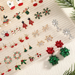 1 par de pendientes de aleación chapados en estilo nórdico con diseño de árbol de Navidad, muñeco de nieve y copo de nieve.