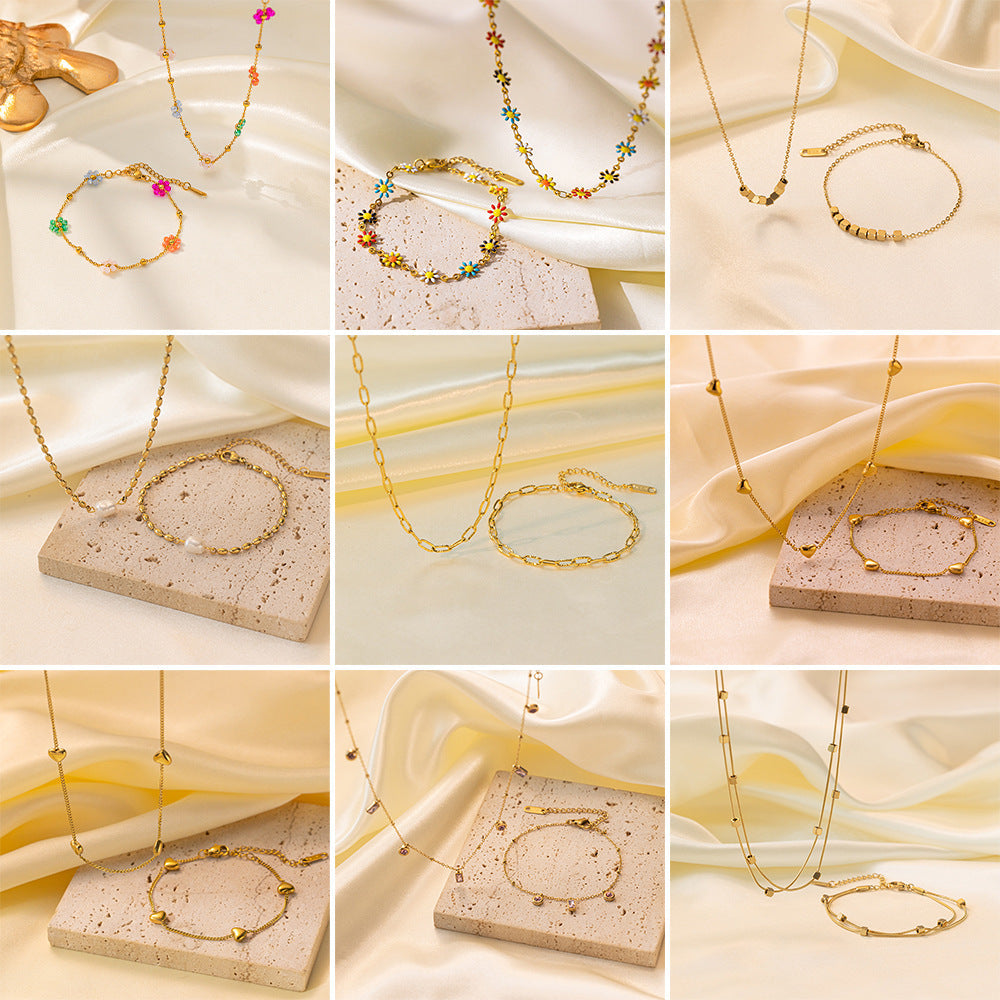 Joyería al por mayor, elegante, estilo urbano, con forma de corazón, mariposa, chapado en acero de titanio, pulseras y collares. 