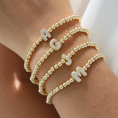 Pulsera de alambre elástico con cuentas de cobre y 26 letras inglesas con globo de burbujas de latón con microincrustaciones Xi Yin
