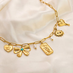 Collar con colgante de acero de titanio chapado en forma de corazón con lazo y ojo de diablo de estilo clásico, joyería al por mayor 
