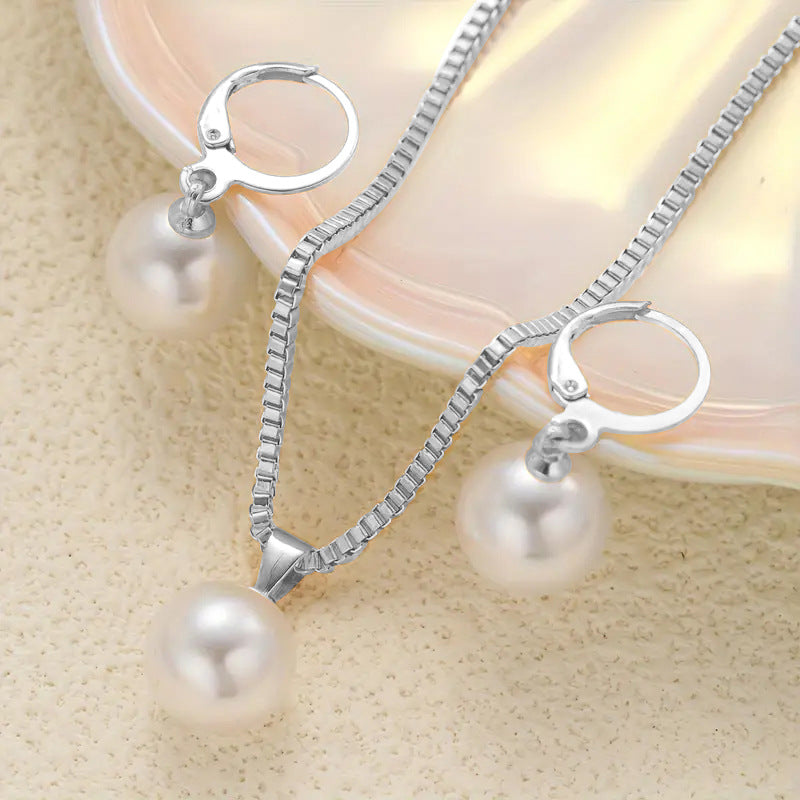 Conjunto de collar y pendientes con colgante de perla 