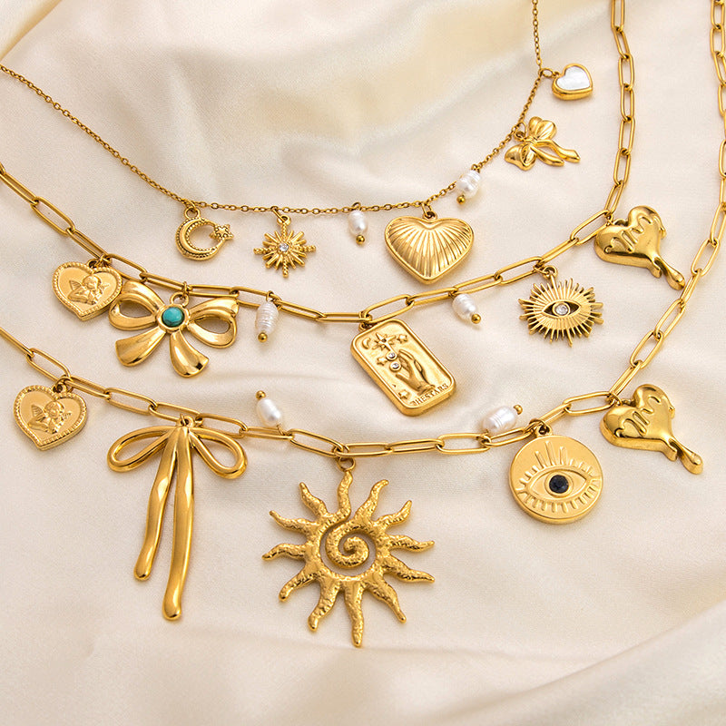 Collar con colgante de acero de titanio chapado en forma de corazón con lazo y ojo de diablo de estilo clásico, joyería al por mayor 