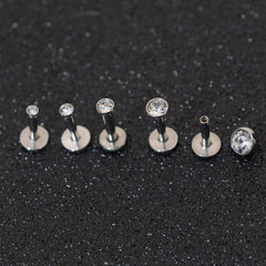 Perno de labio con perforación de bolsa de acero inoxidable de 1,5-4 mm y circonita de 1,2 mm con perforación para nariz y oreja. 