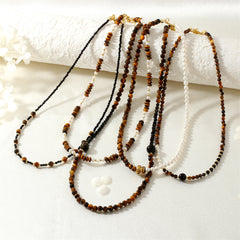 Collar de perlas de moda, collar literario con cuentas de piedra de ojo de tigre en tono Maillard nicho de moda 